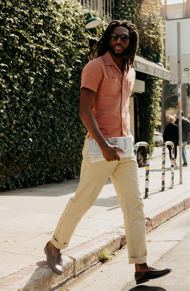 fit model walking wearing The Conrad Shirt in Fired Brick Dobby