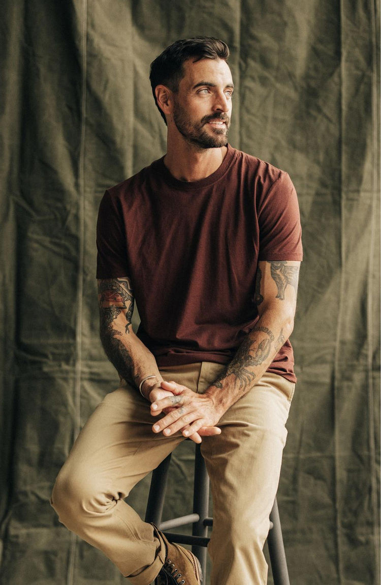 Model sitting in The Cotton Hemp Tee in Black Cherry