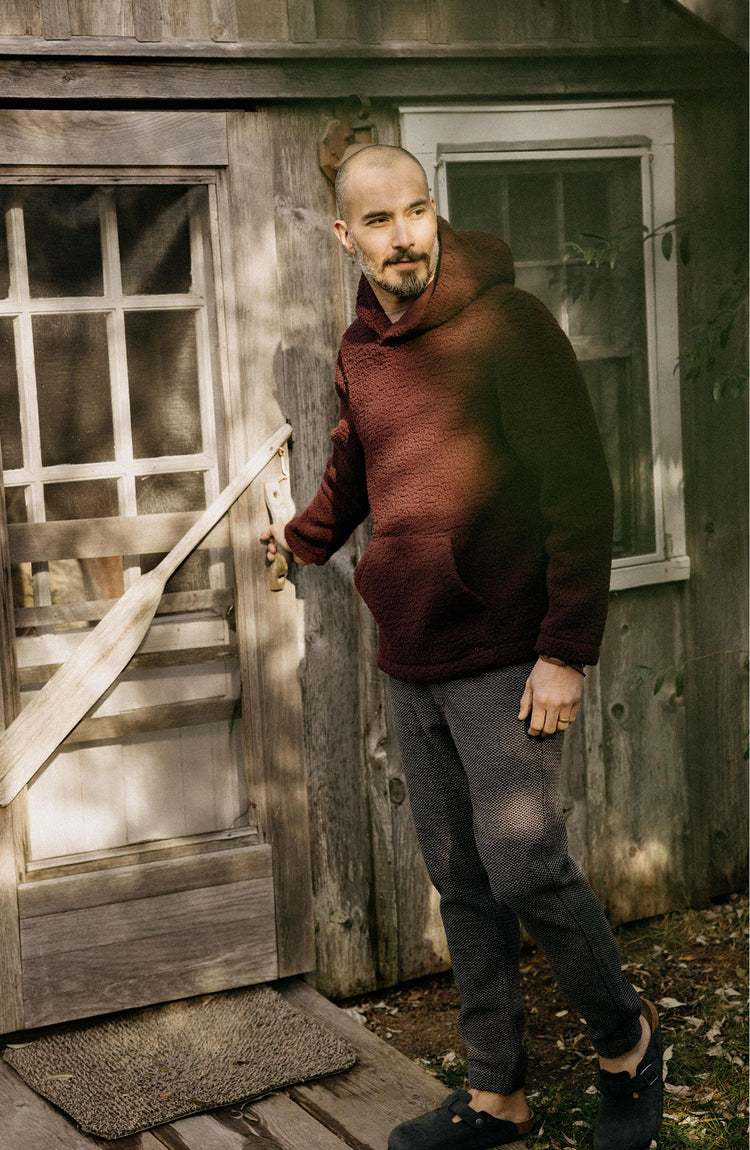 Model wearing The Nomad Hoodie in Burgundy Sherpa