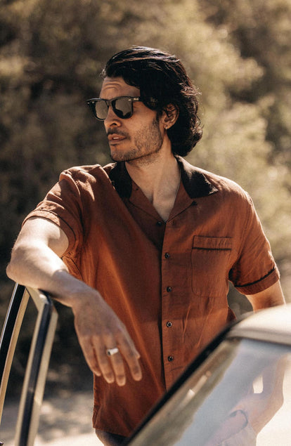 fit model posing by a car door wearing The Palmer Shirt in Dried Guajillo