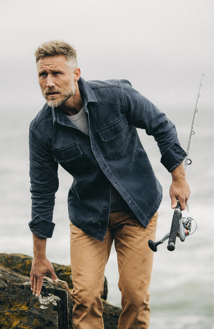 fit model walking wearing The Shop Shirt in Navy Chipped Canvas