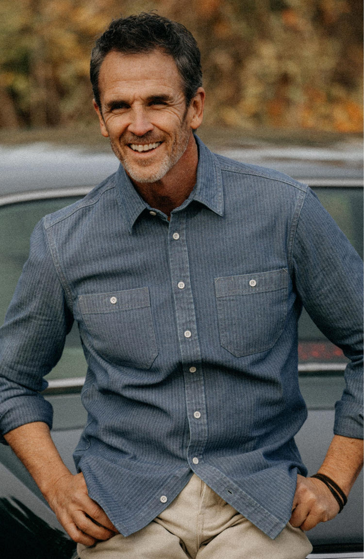 Our model wearing The Utility Shirt in Washed Indigo Herringbone