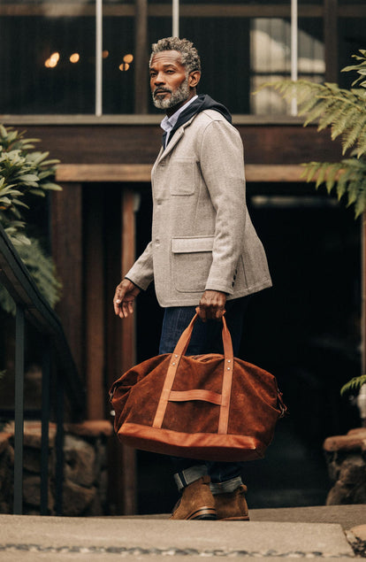 Model holding The Weekender Duffle Bag 