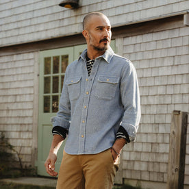 fit model sitting wearing The Division Shirt in Washed Indigo