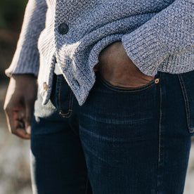 fit model with his hand in the pocket of The Slim Jean in Wallace Wash Organic Selvage