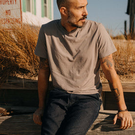 fit model sitting wearing The Cotton Hemp Tee in Steeple Grey