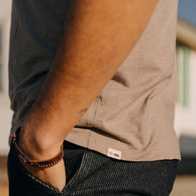 fit model showing off the logo on The Cotton Hemp Tee in Steeple Grey