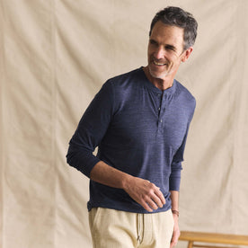 fit model posing in The Merino Henley in Heather Navy