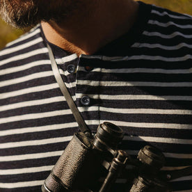 fit model showing off buttons on The Organic Cotton Henley in Rinsed Indigo Stripe