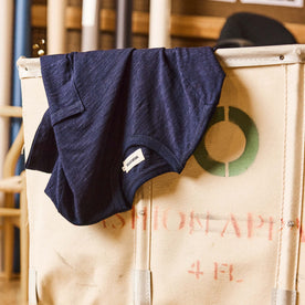 editorial image of The Organic Cotton Tee in Rinsed Indigo in a bin