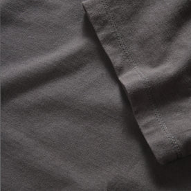 material shot of the sleeve on The Organic Cotton Tee in Faded Black