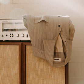 editorial image of The Conrad Shirt in Black Coffee Stripe on a shelf