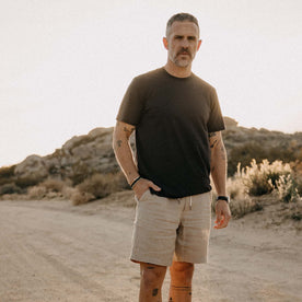 fit model with his hand in his pocket wearing The Cotton Hemp Tee in Charcoal