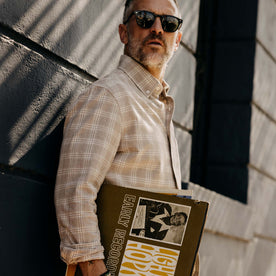 fit model holding records wearing The Jack in Heather Flax Plaid