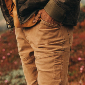 fit model wearing The Chore Pant in Tobacco Boss Duck, hand in pocket