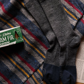 material shot of The Merino Sock in Charcoal next to incense