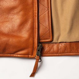 material shot of the zipper on The Moto Jacket in Whiskey Steerhide