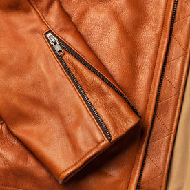 material shot of the cuff detail on The Moto Jacket in Whiskey Steerhide