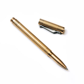 flatlay of The Pen in Brass shown open