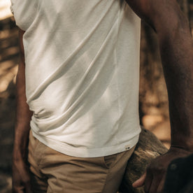 fit model showing the side of The Cotton Hemp Tee in Heathered Oat
