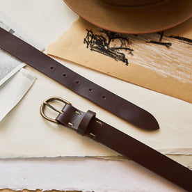 flatlay of The Foundation Belt in Dark Brown on a table