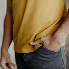 fit model showing the hem on The Organic Cotton Tee in Old Gold